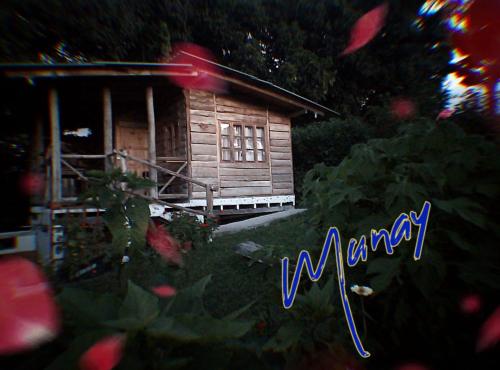 a small wooden house with the word memory in front of it at MUNAY, Posada rural para el sosiego in Alcalá