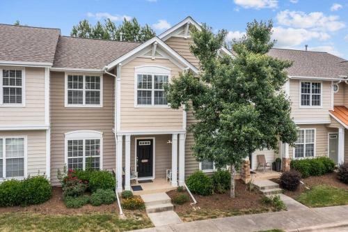 a house with a tree in front of it at Peaceful, townhome in Hope Valley Farms in Durham