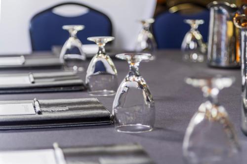 a table with glasses on top of a table at Royal Canadian Lodge in Banff