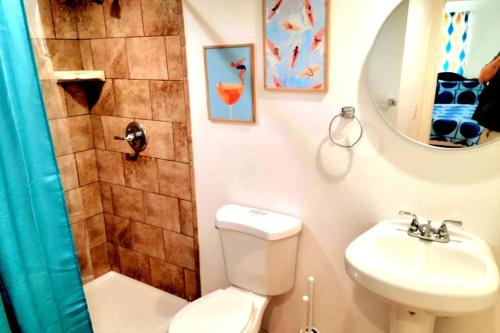a bathroom with a toilet and a shower and a sink at Retro Casita on the River! only 1 min to SNP gate! in Three Rivers
