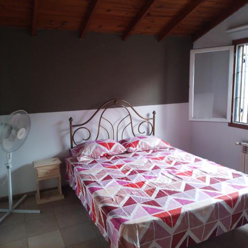 En eller flere senger på et rom på Chalet La Mimosa