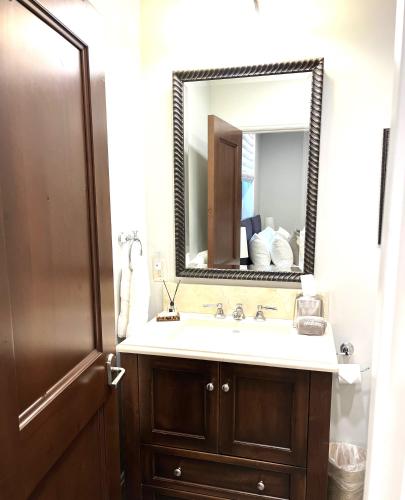 a bathroom with a sink and a mirror at The Residence on South Oak - steps to the gondola! in Telluride