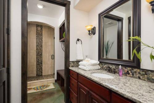 a bathroom with a sink and a mirror at Luxury Downtown Rental (Hot Tub/Pet Friendly) - La Dolce Vita Villas #11 in Moab