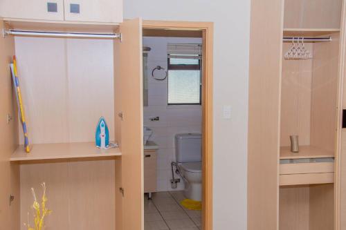 a bathroom with a toilet and a sink at La casa de Miah in Sandton