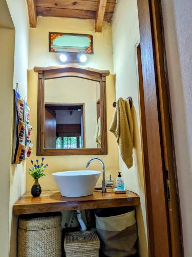 a bathroom with a sink and a mirror at La Salamdra in La Granja