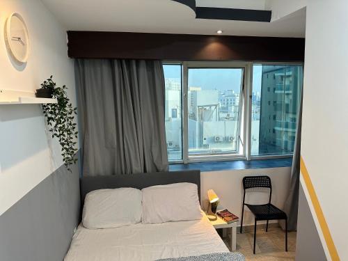 Postel nebo postele na pokoji v ubytování Double Partition Room in Al Barsha 1 Nearest to Metro