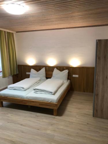 a bedroom with a bed with two white pillows at Apartment Bergblick Semmering in Semmering