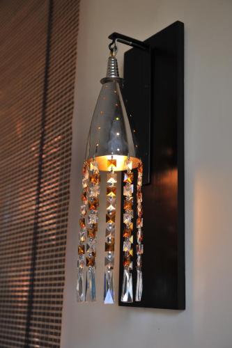 aendant light hanging on the side of a wall at Lazib Inn Resort & Spa in Tunis