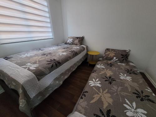 Кровать или кровати в номере Departamento nuevo pucon