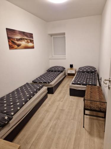 Posteľ alebo postele v izbe v ubytovaní Apartmán NH Stables
