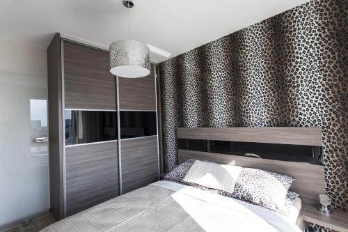 Łóżko lub łóżka w pokoju w obiekcie Apartament Bialystok