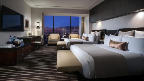 a hotel room with two beds and a television at Red Rock Casino Resort & Spa in Las Vegas