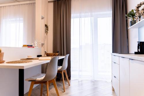 Kuchyň nebo kuchyňský kout v ubytování Hop & Lulu Delux Apartments