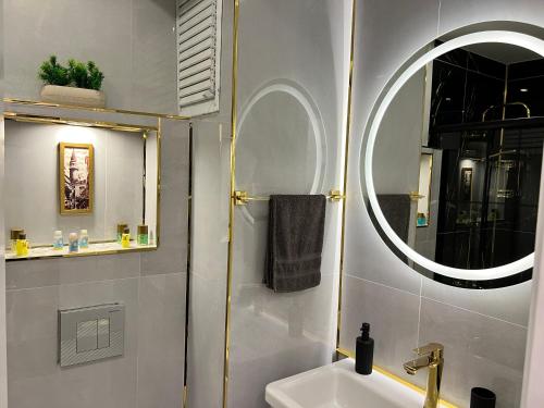 a bathroom with a sink and a mirror at Luxury Suite Golden Horn in Istanbul