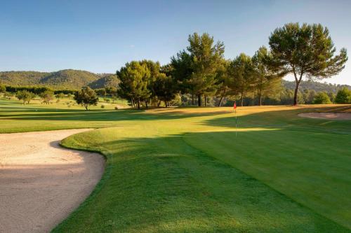 a view of a golf course with a sandewayewayfficientfficientfficientfficientfficient at Castillo Hotel Son Vida, a Luxury Collection Hotel, Mallorca in Palma de Mallorca