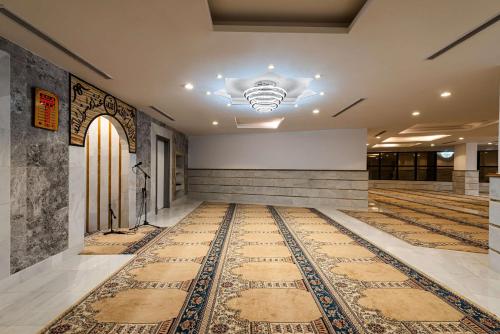 an empty lobby with a rug on the floor at Best Western Ajyad Makkah in Makkah