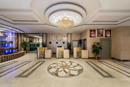 a lobby of a hotel with a chandelier at Best Western Ajyad Makkah in Mecca