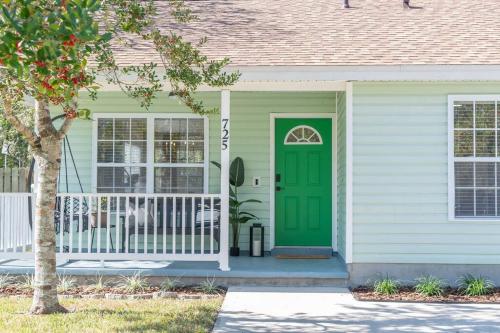 a green door on a house with a porch at The Emerald of St. Augustine in St. Augustine