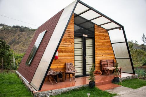 a tiny house with a pitched roof and windows at Destinos Exclusivos Patate in Patate