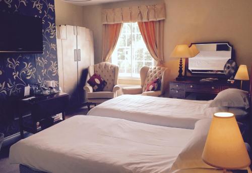 מיטה או מיטות בחדר ב-Walter de Cantelupe Inn