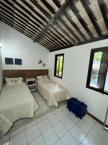 Postel nebo postele na pokoji v ubytování Casa em Guarajuba