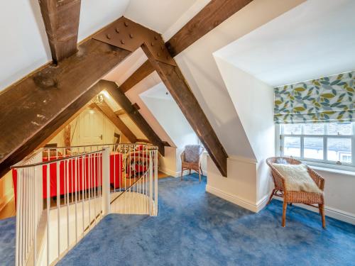 a attic room with a staircase and a window at Moonlight Apartment - Uk46023 in Durham