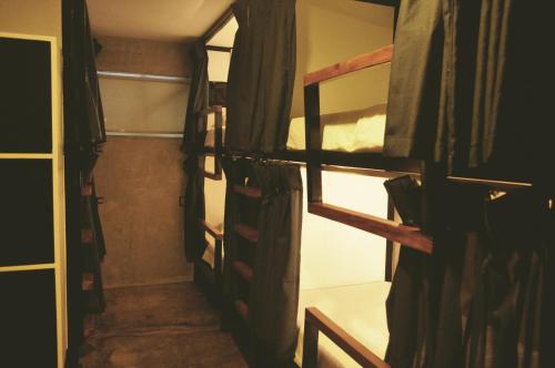 a group of bunk beds in a room at Beach People Hostel Bantayan Island in Ocoy