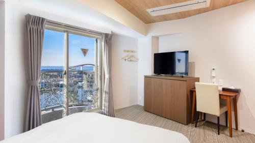 Postel nebo postele na pokoji v ubytování kisarazu bay Town Hotel