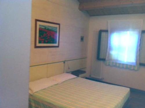 เตียงในห้องที่ Agriturismo Accipicchia