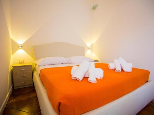 Postel nebo postele na pokoji v ubytování Casa dei Carrubi