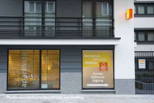 a store front of a building with a window at Aparthotel Adagio Access Paris Quai d'Ivry in Ivry-sur-Seine