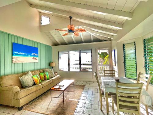 a living room with a couch and a table at Big Island Retreat - No Resort Fees in Kailua-Kona