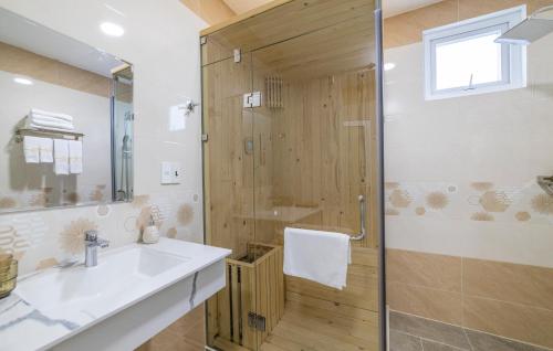 a bathroom with a sink and a shower at The Grandview Villa Dalat in Da Lat