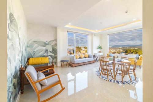 a living room with a table and chairs at The Grandview Villa Dalat in Da Lat