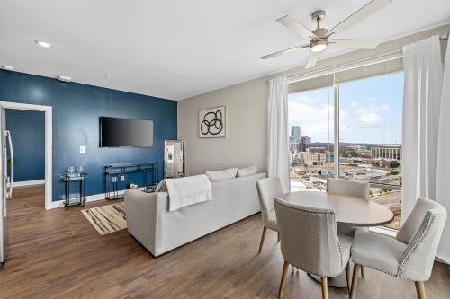 a living room with a couch and a table at The Malibu Suite Penthouse The Gulch in Nashville
