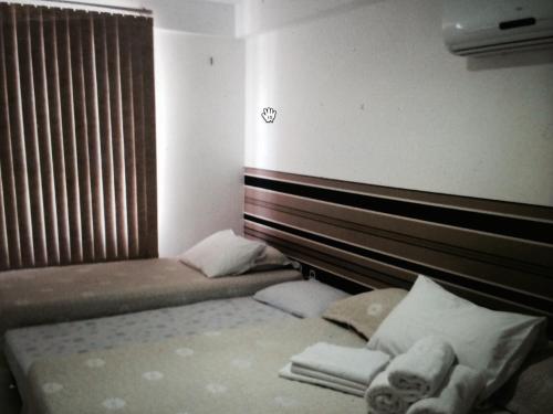 Postelja oz. postelje v sobi nastanitve Apartamento Tambaú