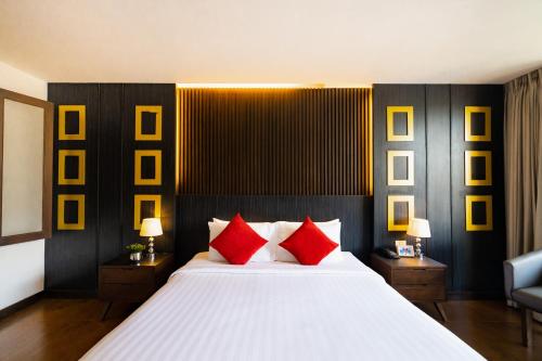 Postel nebo postele na pokoji v ubytování Hotel J Pattaya