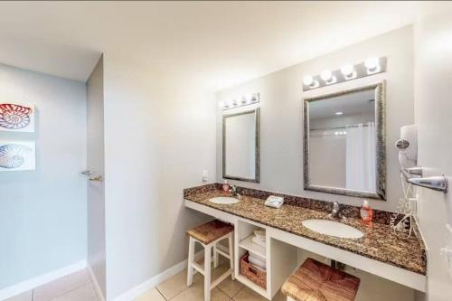 a bathroom with two sinks and a mirror at Panama City Beach Ocreanfront 2BR in Splash Resort 402W in Panama City Beach