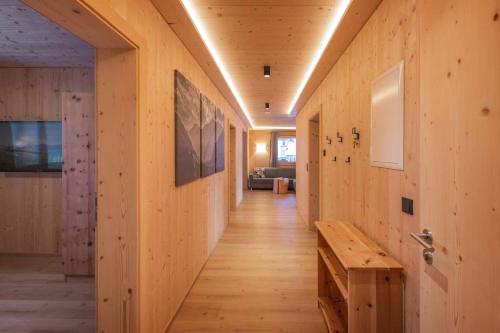 a hallway of a house with wooden walls and a wooden bench at Luxury Naturperle Haus Alpenprinzessin helles Holzhaus zentral , modern & großräumig in Neustift im Stubaital