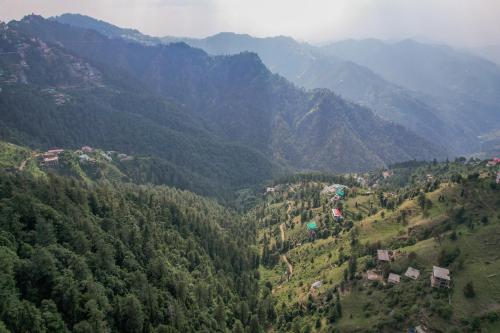 an aerial view of a mountain valley with trees at Saanjh - The Musical Sunset in Shimla