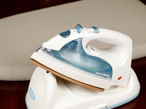 a white iron sitting on top of a table at Zentsuji Grand Hotel in Zentsuji