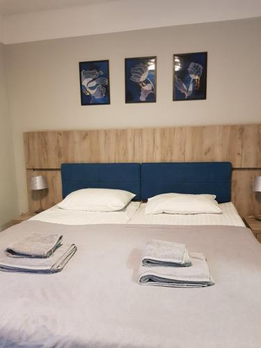 Una cama o camas en una habitación de Willa Rustykalna