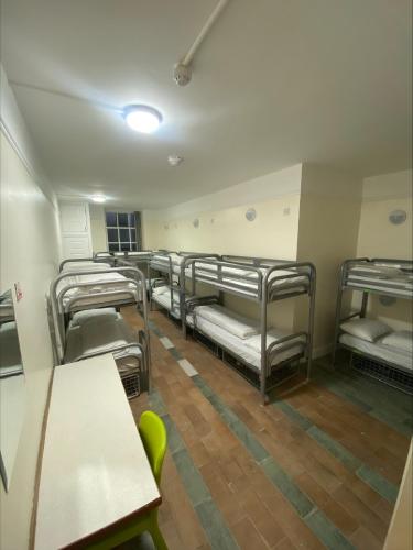 a row of bunk beds in a room at Gogartys Temple Bar Hostel in Dublin