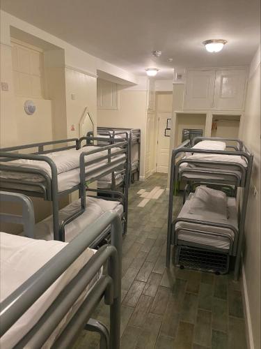 a row of bunk beds in a room at Gogartys Temple Bar Hostel in Dublin