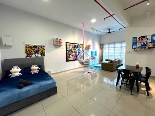 a bedroom with a blue bed and a dining room at B1610 Austin Height Crayon shin chan Home By Stay in Johor Bahru