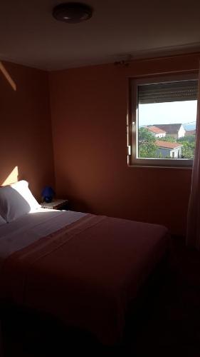 מיטה או מיטות בחדר ב-Apartment Antolkovic