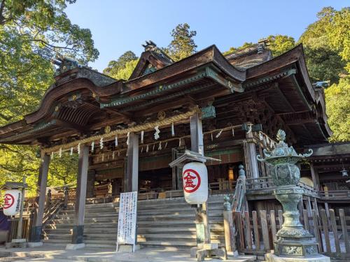 a temple in a park with a building at Zentsuji Grand Hotel in Zentsuji