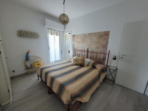 Ένα ή περισσότερα κρεβάτια σε δωμάτιο στο Casa Bea Marinella