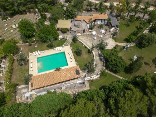 an aerial view of a house with a swimming pool at Masseria Cucuruzza Boutique Hotel in Felline