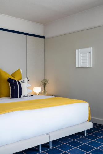 Ένα ή περισσότερα κρεβάτια σε δωμάτιο στο Home Suite Hotels Sea Point